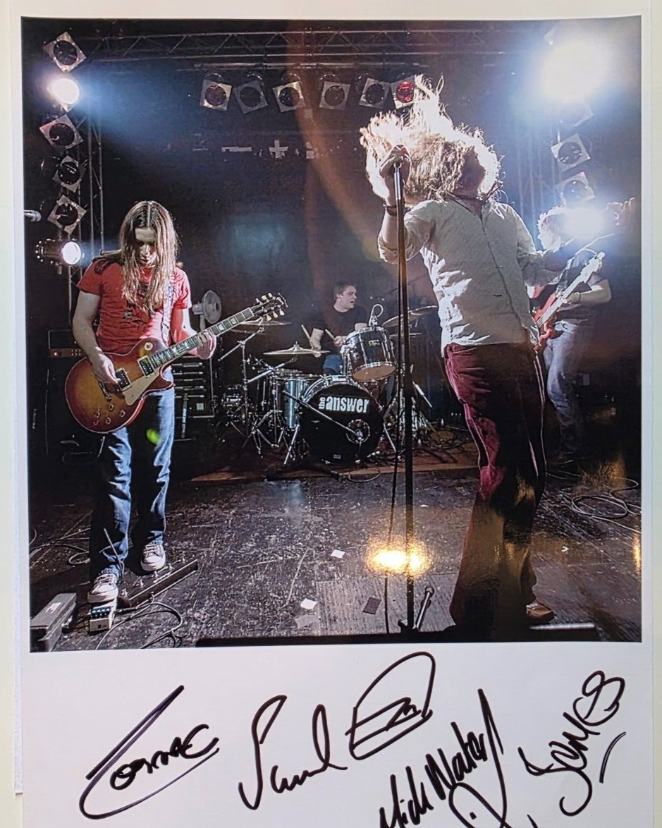 The Answer Hand signed A4 glossy presentation by the band rock memorabilia